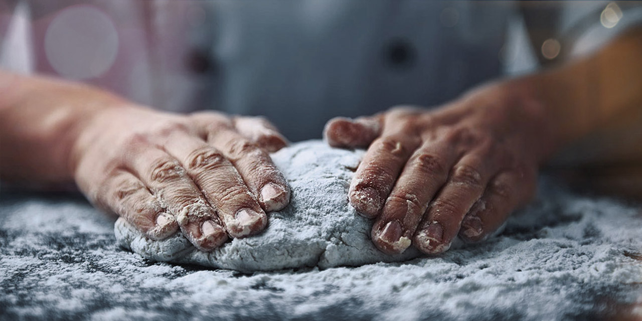Bread dough being kneaded