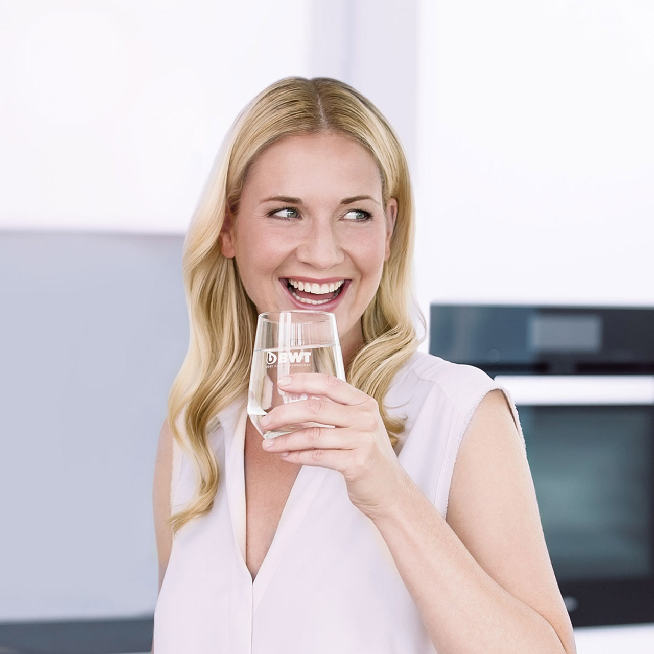 Woman enjoying a glass of fresh water