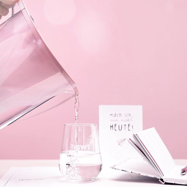 Pouring a glass of mineralized water