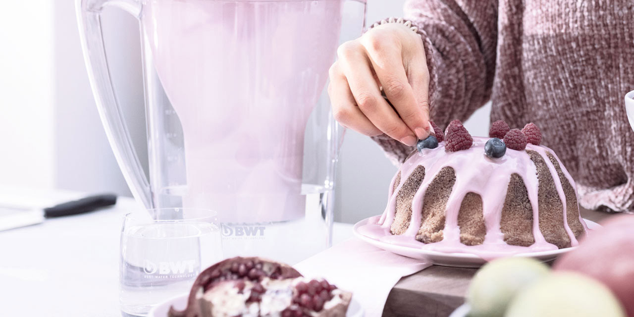 Woman decorating a cake