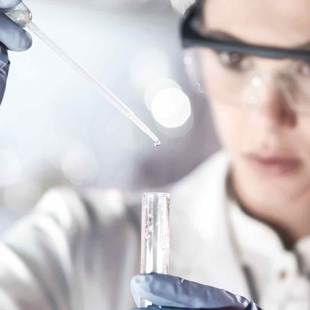 Female chemist analysing water